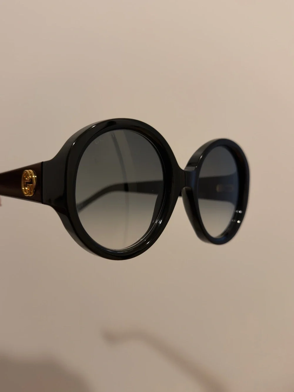 Gucci Black Round Sunglasses with Gold Logo Accent